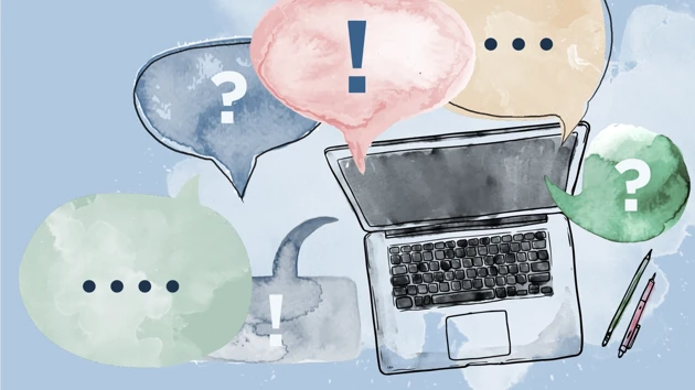 A computer with speech bubbles with question and exclamation marks.