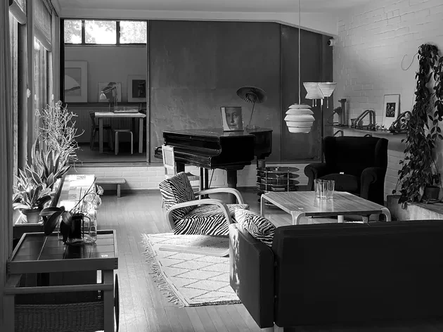 Interior of a room with furniture, black and white